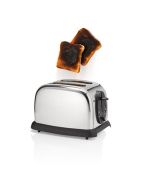 Burnt bread pops out from toaster.
