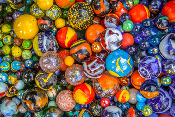 Fototapeta na wymiar Background of marbles in many colors