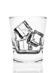 Glass of ice cubes isolated on white background