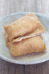 Sushi flavored boiled rice wrapped in fried tofu