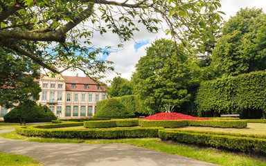 Fototapeta premium view on abbots palace and flowers in gdansk oliva park.