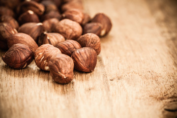Hazelnuts on rustic old wooden table
