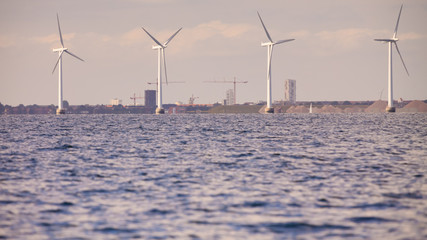 wind turbines power generator farm along coast sea