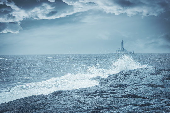 Lighthouse on a stormy day, artistic toned photo