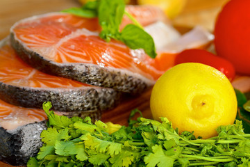 Delicious  portion of fresh salmon fillet with lemon and parsley