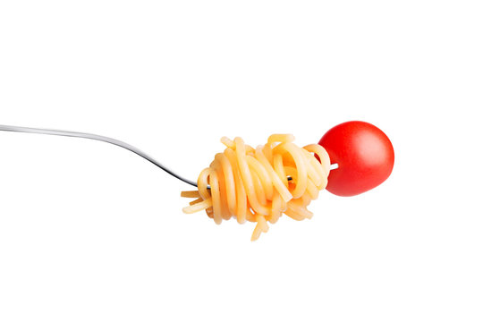 Fork with spaghetty and tomato isolated on white background