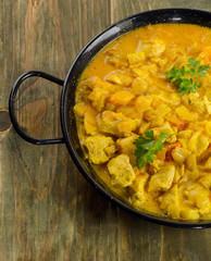 Chicken curry on a wooden table