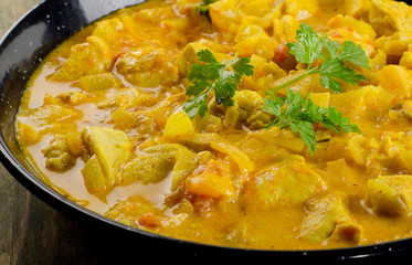 Chicken curry on  wooden table