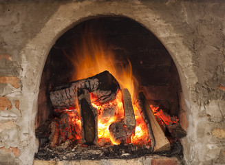 Cozy blazing fire in fireplace