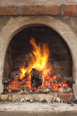 Cozy blazing fire in fireplace