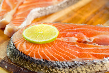 Fresh salmon fillet with lemon - healthy food concept