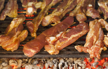 Cooking meat on a barbecue in back yard