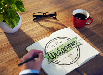 Man with Note Pad and Welcome Concepts
