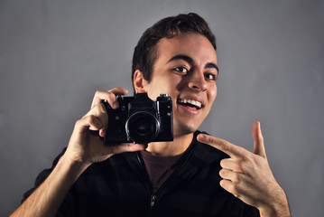 young photographer with analog camera