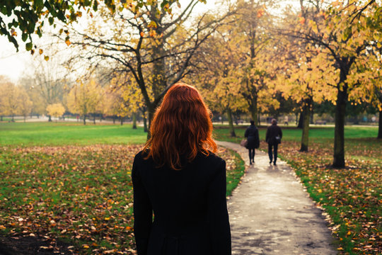 Young woman walking in park