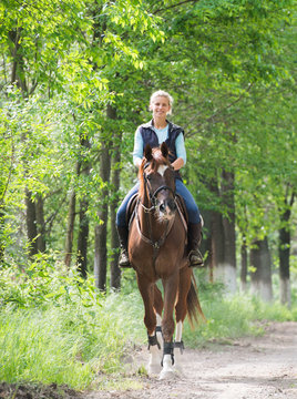Girl on horseback riding