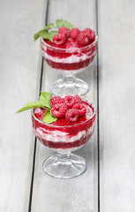 Layer raspberry dessert on garden party table.