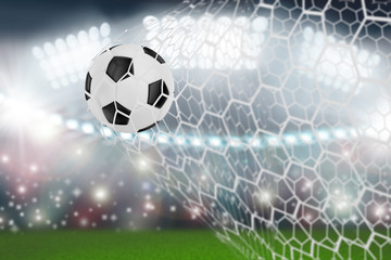 soccer ball in goal net