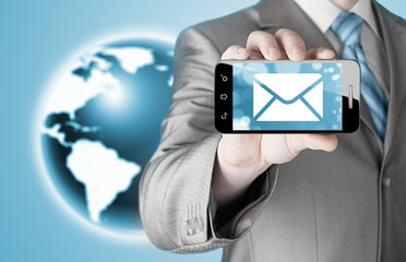 A man holding smartphone with one new message on a screen.
