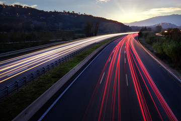 Fototapeta na wymiar Light beams of vehicles on highway.