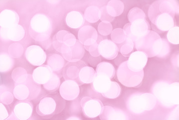 Holiday pink background with blurred bokeh lights