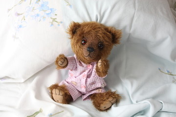 Cute teddy bear in pink pyjama