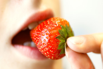 girl eating strawberries