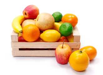 Artificial plastic fruits in wooden crate