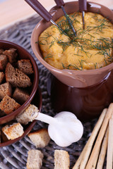 Fondue, bowl of rusks, biscuits, spice and garlic