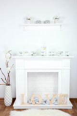 Fireplace with beautiful decorations in living room