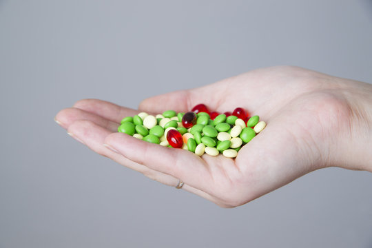 Pills in women hand