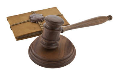 wooden mallet and a book