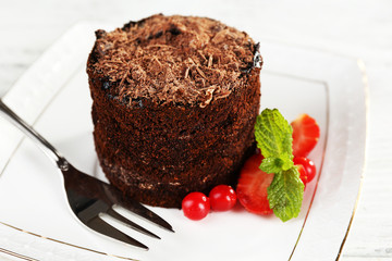 Yummy chocolate cupcake on table