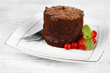 Yummy chocolate cupcake on table