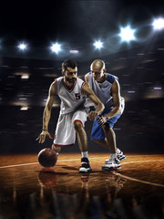 Two basketball players in action