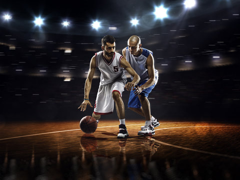 Two basketball players in action