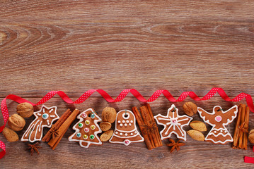 christmas wooden background with gingerbread cookies