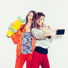 Two young naughty girls having fun. Lifestyle