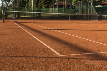 Clay (Dirt) Tennis Court.