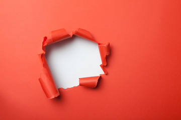 Red paper with hole - obrazy, fototapety, plakaty