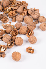 Heap of cracked walnuts.