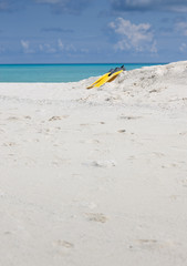 Obraz premium Idyllic beach of Indian ocean with yellow flippers