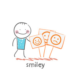 a man stands next to posters with smiles