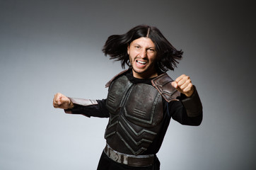 Angry warrior against dark background