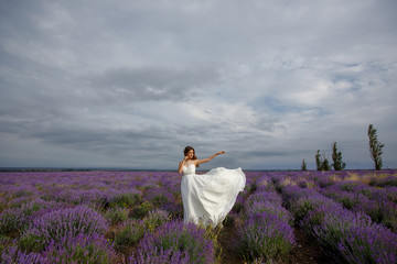 Beautiful bride in wedding dress in lavender field