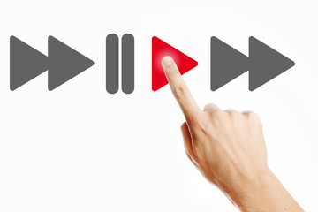 Male hand pressing play button on the virtual screen