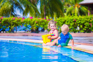 Fototapeta na wymiar Kids at a swiming pool