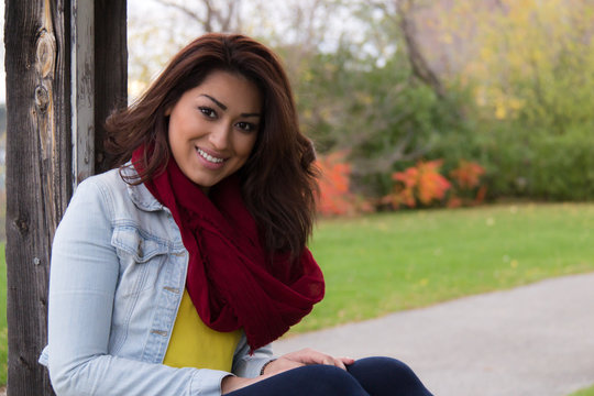 Attractive Latino woman outdoors during autumn