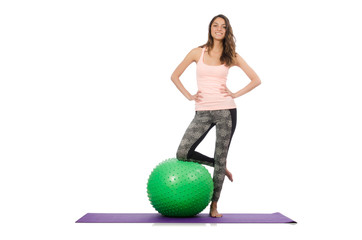 Young woman exercising with swiss ball