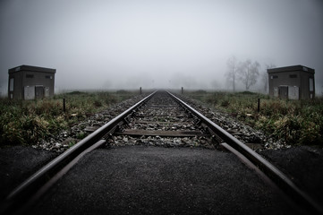 Fototapeta na wymiar Train railways on a misty morning in Austria.